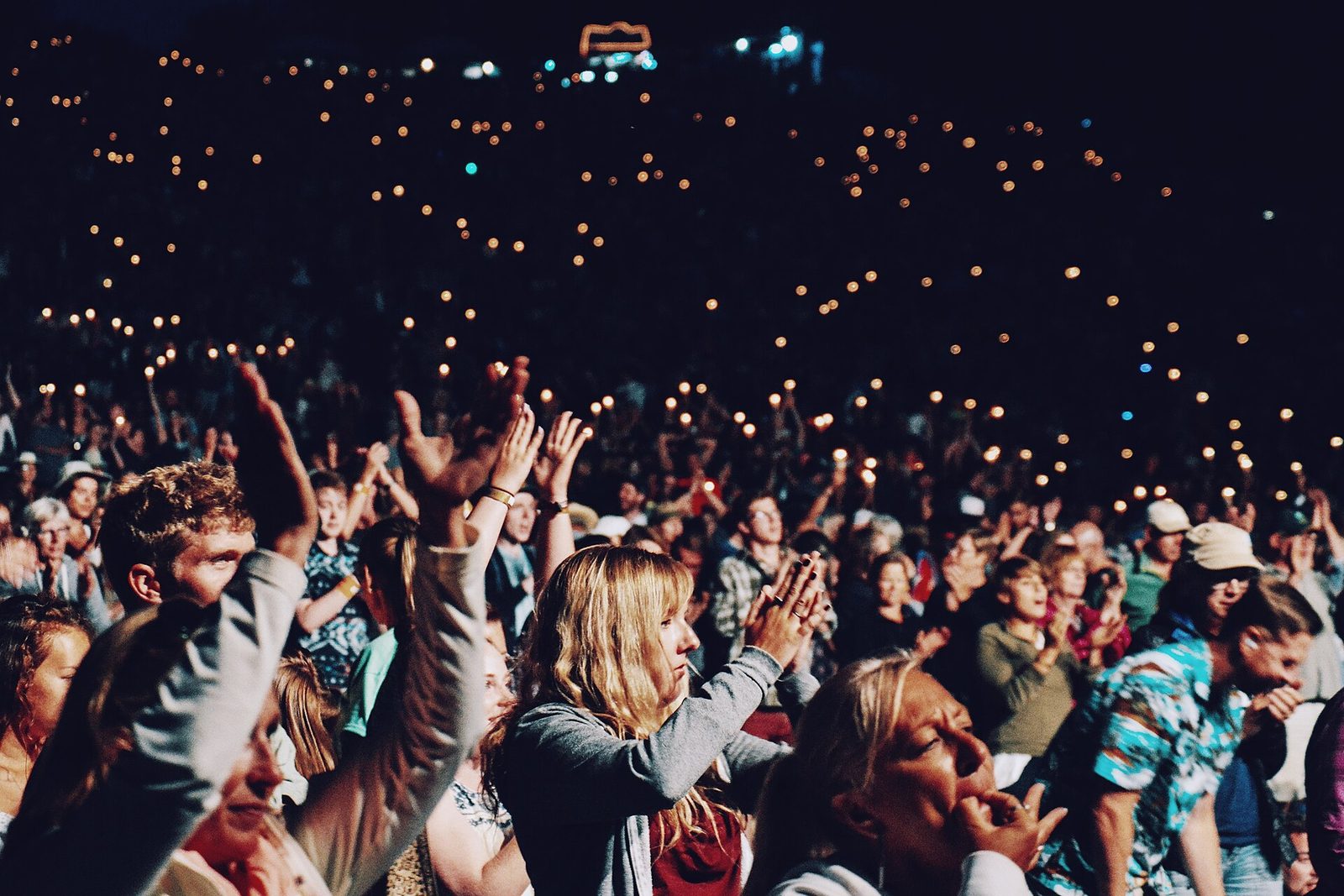 concert crowd hands raised