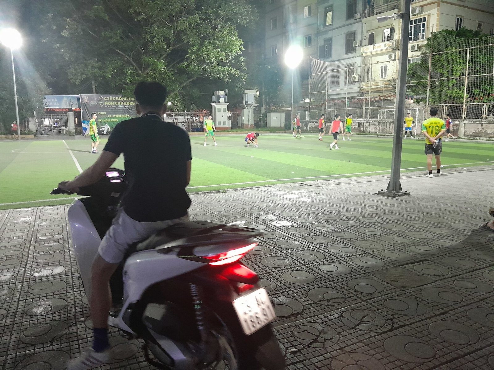 football pitch floodlights night